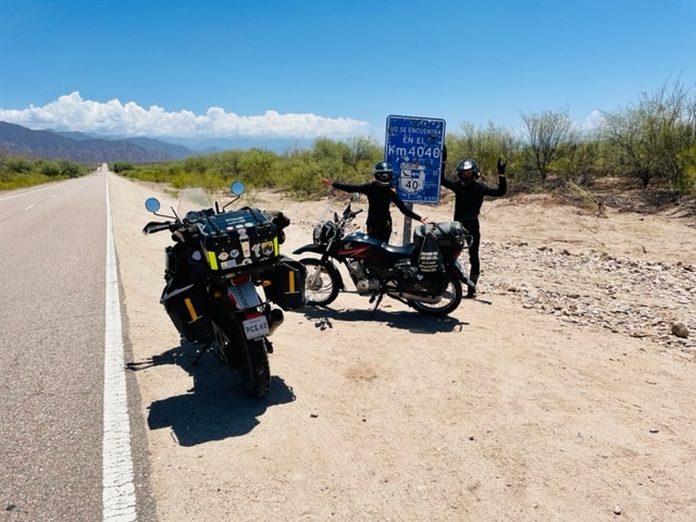 Adriana Potts and Rusty on the road with motorcycles