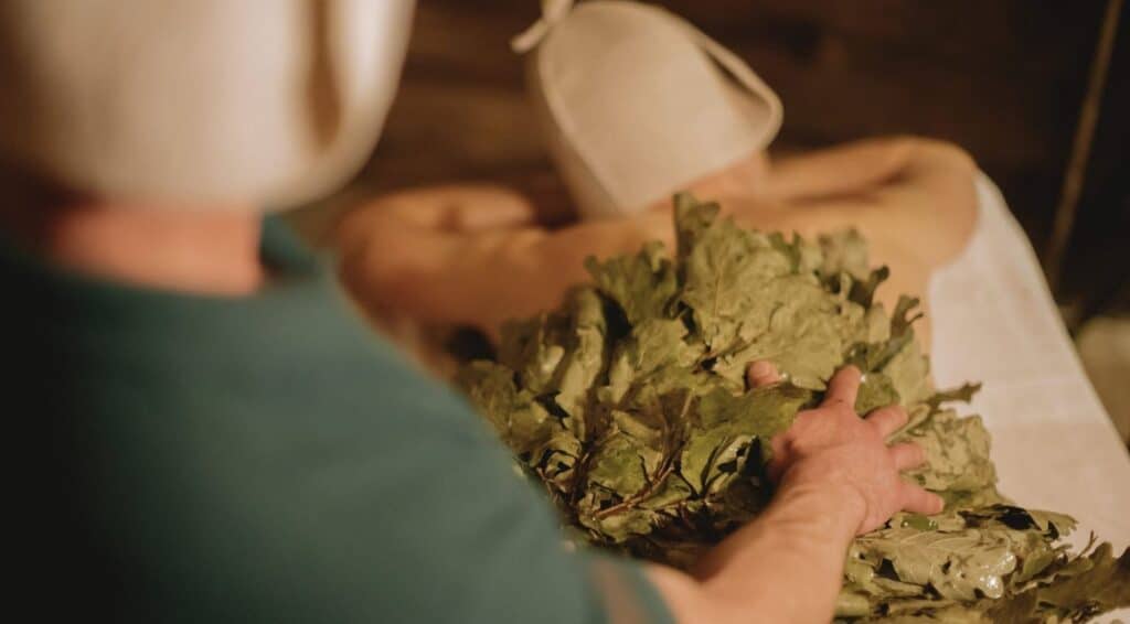 The parenie ritual The Bath House Banya London person getting hit with leaves