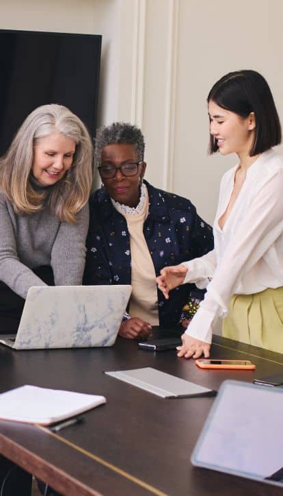 older women working with younger woman