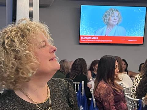 Eleanor with a herself on a screen behind