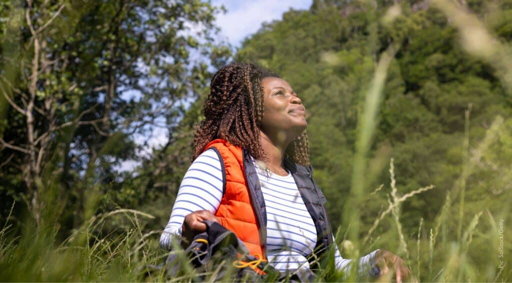 woman in countryside illustrating the best silent retreats in the UK